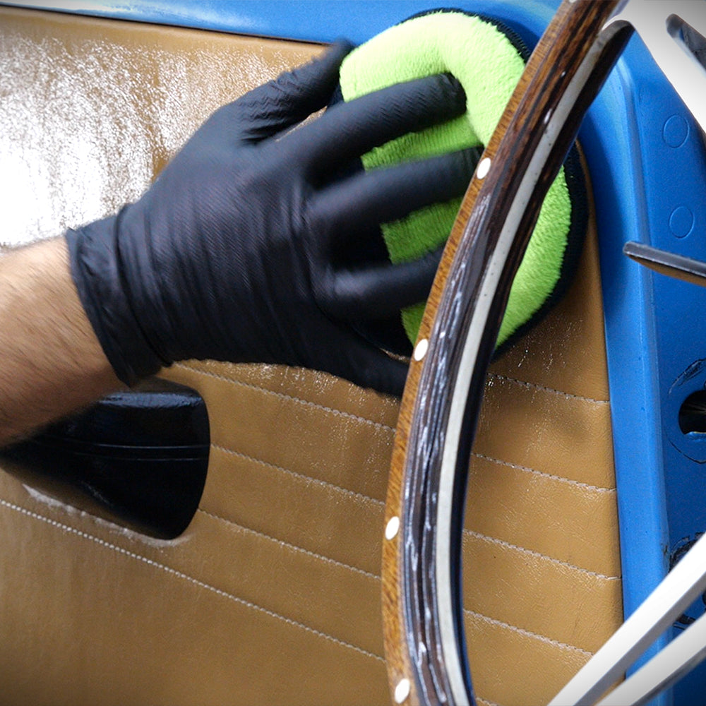 Apply microfibre applicator pad being used on car door